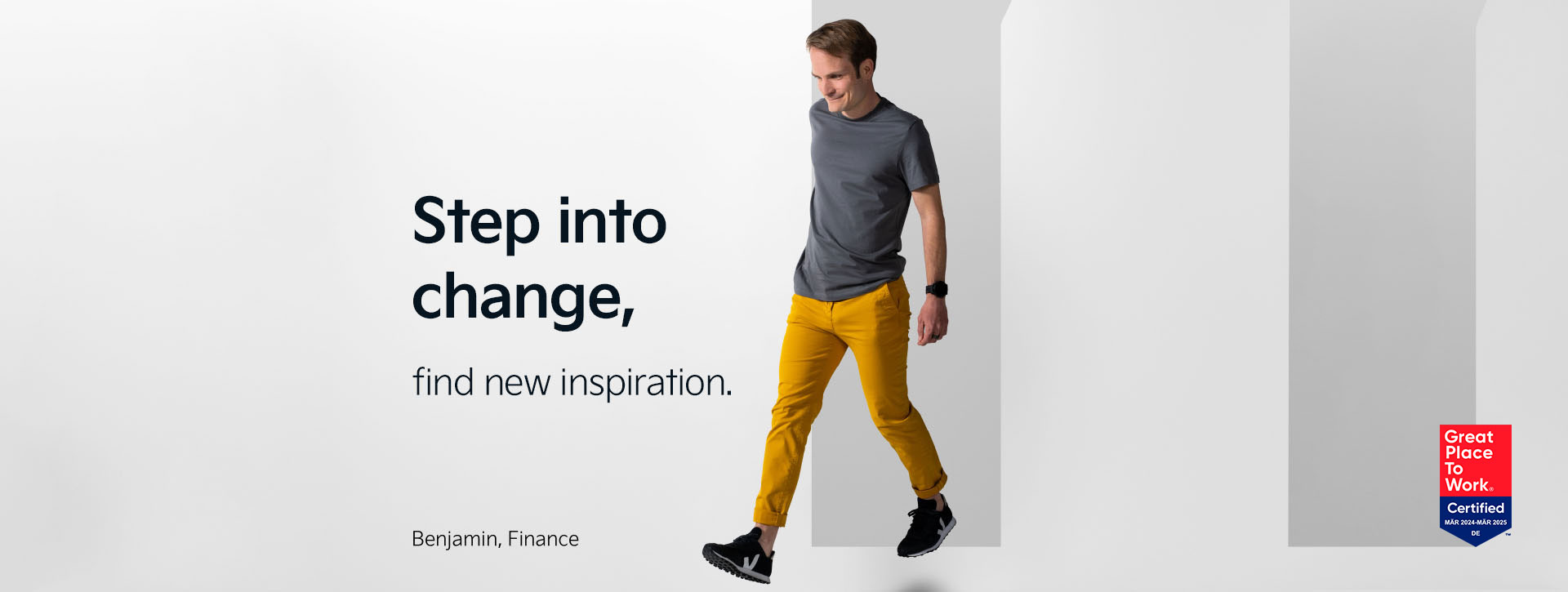 Benjamin from our Finance department makes a step forward. Behind him is the letter "M". Next to him we find the statement "Step into change - find new inspiration".