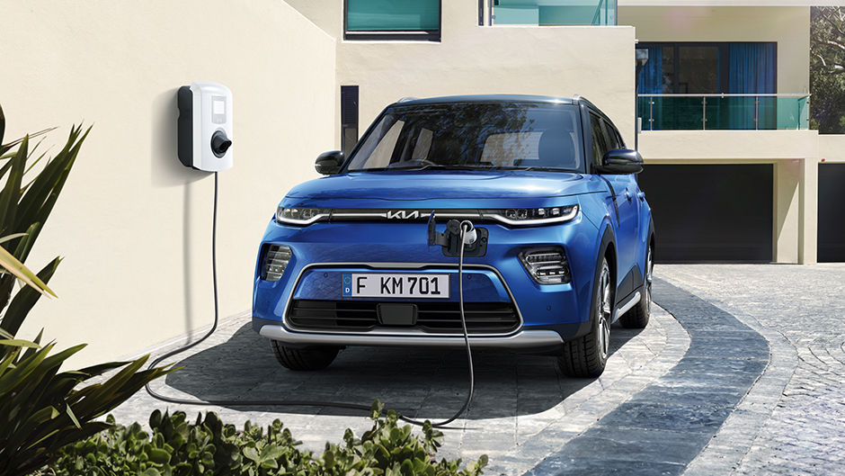 Blue Kia Soul EV front charging