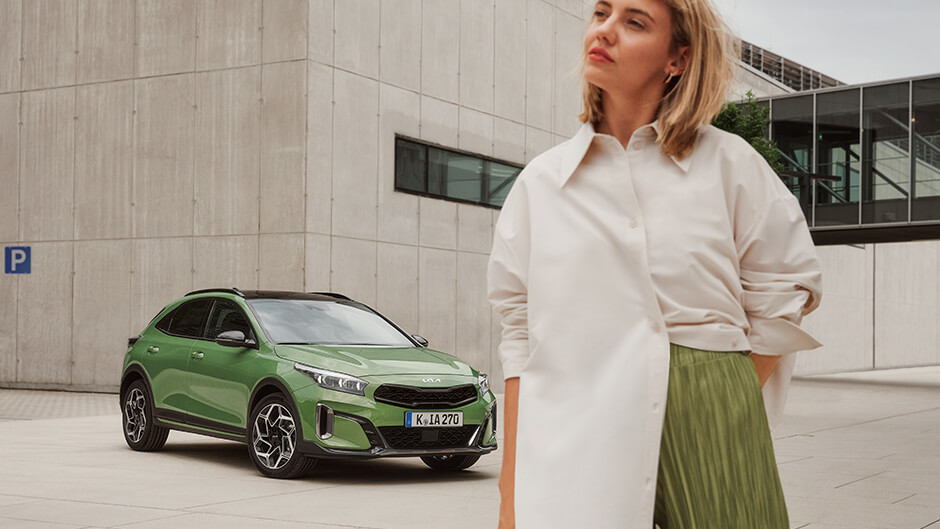 Kia niro EV charging with model sitting on car